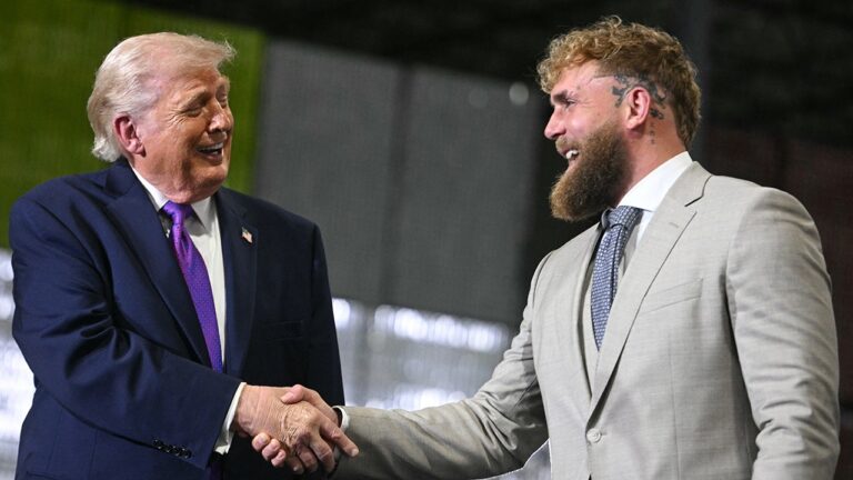 Jake Paul speaks as President Trump reacts at Verst Logistics in Hebron, Kentucky